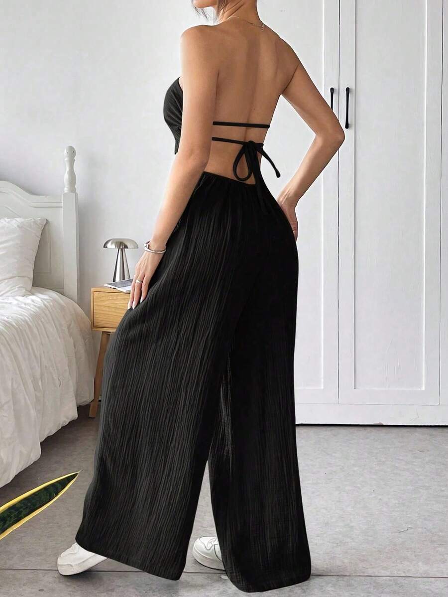 Mono sin espalda, diseño monocromo, pantalones holgados, estilo sensual. - Negro - Ver 1