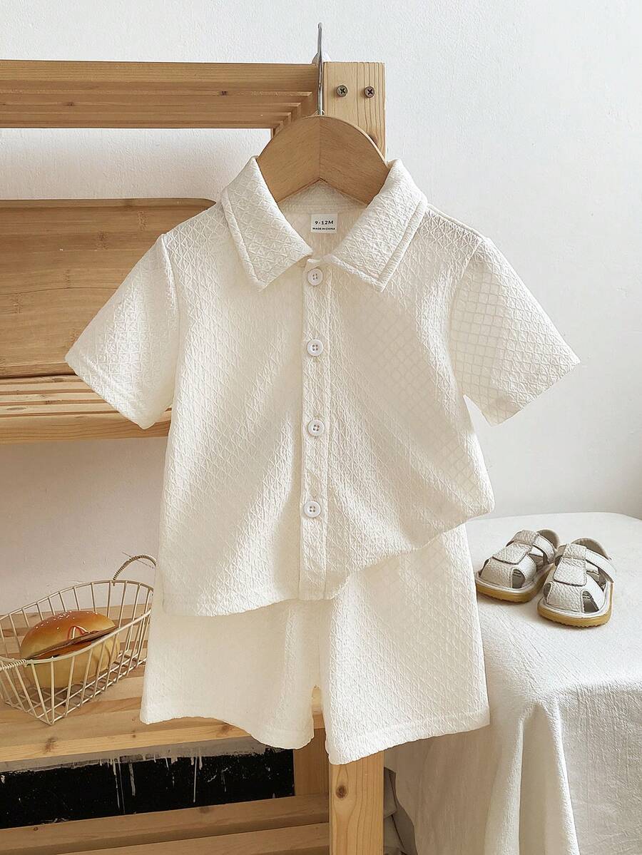 SHEIN 2pcs/Set Spring & Summer New Casual Style Solid Color Jacquard Texture Button Pocket Collar Shirt & Elastic Waist Pleated Shorts Matching Comfortable Baby Boy Outfit, Kid Clothes,Toddler Clothes, Baby Outfit,Toddler Coat ,Toddler Shorts,6M-3T Baby Boy Shirt And Short Set Baby Boy Short Sleeve Suits Neutral Baby Clothes Unisex Baby Boy Casual Outfit  Baby Collar Shirt Baby Button Shirt Black Toddler Shirt Unisex Baby Clothes