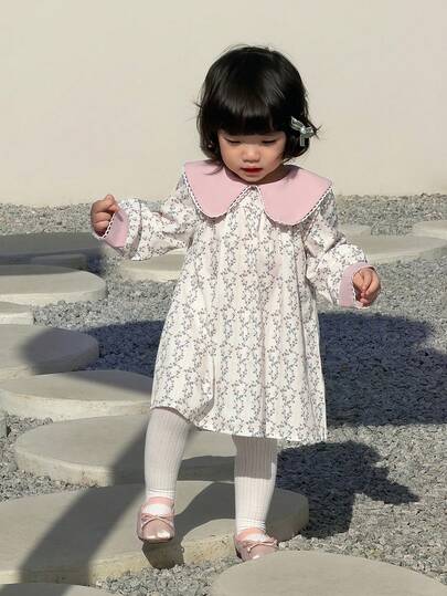 Baby Girls Spring And Autumn Pink And White Contrasting Long-Sleeved Doll-Neck A-Line Flowing Dress Features A Sweet, Pastoral, And Retro Fairy Tale Style. The Fabric Is Of Moderate Thickness, With Delicate Lace Trim On The Edge Of The Doll-Neck. The Dress Is Fully Printed With Floral Patterns Like Gently Winding Vines, Making It Suitable For School, Birthday Parties, First Birthday Gifts And Weddings. Outdoor Play And Garden Picnic
