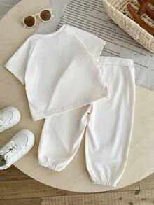 SHEIN Bộ đồ mùa xuân 2 món cho bé gái, kiểu dáng thường ngày năng động và thoải mái, thêu họa tiết, gồm áo tay phồng ngắn cổ tròn và quần dài kẻ sọc. - trắng - Xem 2