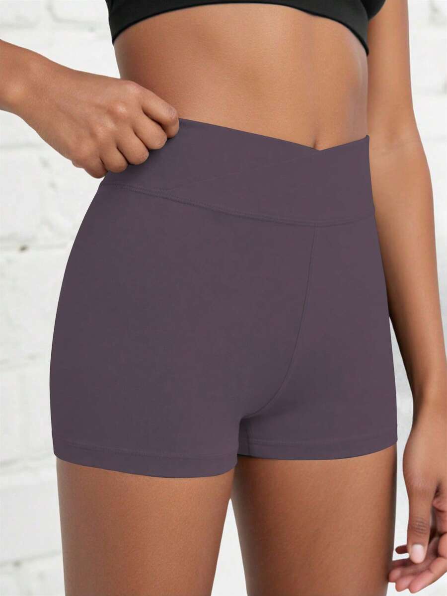 SHEIN Quần short thể thao cho bé gái tuổi teen, màu trơn, kiểu dáng tối giản, cạp chéo, chất liệu co giãn 4 chiều, thích hợp cho đạp xe, chạy bộ và tập luyện.