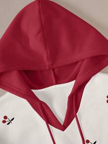 Resyla Sweat-shirt à capuche pour femmes, motif cerise, manches longues, idéal pour l'automne/l'hiver, la rentrée scolaire, la fête des enseignants, les tenues de plein air, la photographie de rue, les vacances et les tenues décontractées. Un must-have, attrayant, en blanc. Sweat-shirt à capuche à manches longues pour femmes, avec un contraste rouge et blanc.