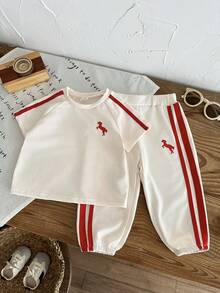 SHEIN Bộ đồ mùa xuân 2 món cho bé gái, kiểu dáng thường ngày năng động và thoải mái, thêu họa tiết, gồm áo tay phồng ngắn cổ tròn và quần dài kẻ sọc. - trắng - Xem 6