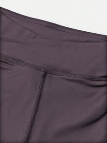 SHEIN Quần short thể thao cho bé gái tuổi teen, màu trơn, kiểu dáng tối giản, cạp chéo, chất liệu co giãn 4 chiều, thích hợp cho đạp xe, chạy bộ và tập luyện. - Bụi tím - Xem 8