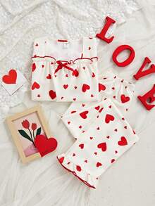 女童两件套睡衣：短袖上衣，饰有蝴蝶结和爱心印花，荷叶边下摆；宽松长裤，荷叶边下摆。 - 杏色 - 查看 5