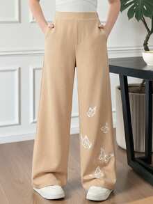 SHEIN بنطلون أسود فضفاض بقصة ساق واسعة مع طباعة وض...