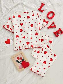 女童两件套睡衣：短袖上衣，饰有蝴蝶结和爱心印花，荷叶边下摆；宽松长裤，荷叶边下摆。 - 杏色 - 查看 9