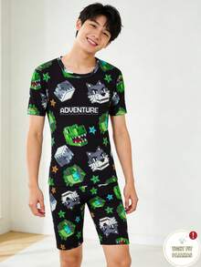 SHEIN 一套男童游戏主题睡衣，紧身款，黑色底，印有恐龙和狼头图案，短袖上衣和短裤，款式活泼，面料柔软舒适，可机洗，适合小男孩穿着。 - 黑色 - 查看 6