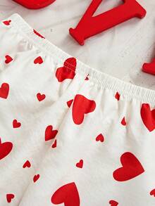 女童两件套睡衣：短袖上衣，饰有蝴蝶结和爱心印花，荷叶边下摆；宽松长裤，荷叶边下摆。 - 杏色 - 查看 7