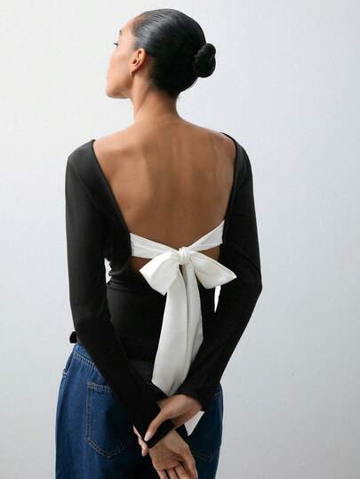 Maija 黑白撞色蝴蝶结露背长袖T恤，适合情人节、派对、夏季、圣诞节、新年等场合穿着，优雅百搭，休闲修身，适合夏季穿着。