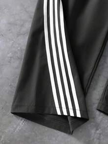 Pantalones largos de pierna ancha para niñas preadolescentes - Gris oscuro con rayas blancas, con cintura con cordón y decoración de lazo. Cómodos y holgados, adecuados para niños mayores. El diseño de la raya lateral agrega un toque a este pantalón largo casual y elegante. La tela es cómoda, lo que lo convierte en una opción de moda ideal para el uso diario de niñas preadolescentes. - Gris Oscuro - Ver 5