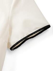 GlowEve CURVE Conjunto informal de 2 piezas para mujer talla grande con camisa de cuello redondo en color albaricoque con ribete de contraste y manga corta, y pantalón ancho y suelto de pierna ancha en color negro - Albaricoque - Ver 6