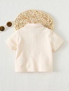 Cozy Pixies Koszula kardigan z teksturowanej tkaniny żakardowej dla chłopca w kontrastowym kolorze, haftowany mały konik, jednokolorowa, miękka dzianina, kołnierzyk wykładany, krótki rękaw - Morela - Zobacz 2