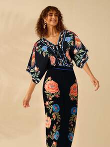 CAJUNI Mono de verano de estilo boho con estampado de loro de colores y flores tropicales, cuello en V profundo anudado, para vacaciones y ocio en la playa