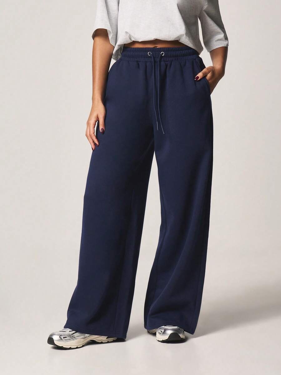 MISSGUIDED Pantalones de chándal de pierna ancha con cordón de mujer en color azul marino, cintura elástica, ajuste holgado, con bolsillos laterales, pantalones cómodos para estar en casa - Azul Marino - Ver 1