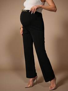 MaterniChic Pantaloni eleganti da donna in gravidanza con catena in metallo decorativa in vita, di colore unito - nero - Visualizzare 1