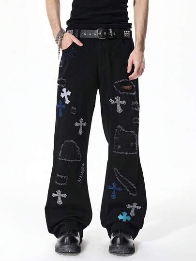 Jeans a zampa con grafica a croce di strass e tasche consumate per uomo