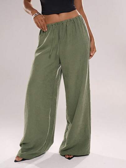 Avantive Dambyxor med vida ben och dragsko i midjan, enfärgade och avslappnade