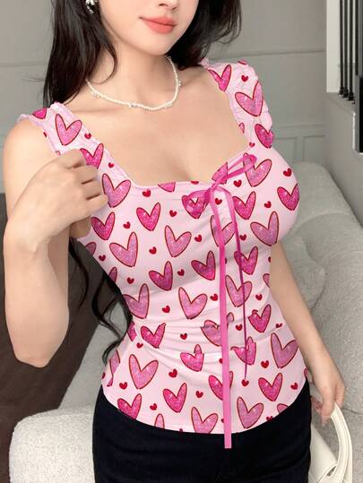 Modelyn Top ajustado sin mangas con estampado de corazón brillante, lazo y nudo, para mujer