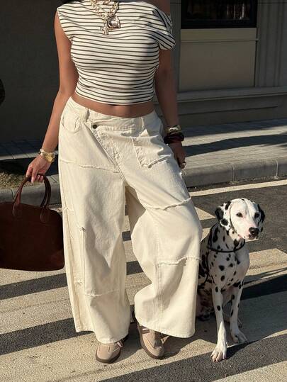 Muchica Quần jeans nữ cỡ lớn dáng rộng, ống rộng, phối nhiều mảnh vải, gấu quần tua rua, có túi, eo bất đối xứng, phù hợp cho mọi mùa.