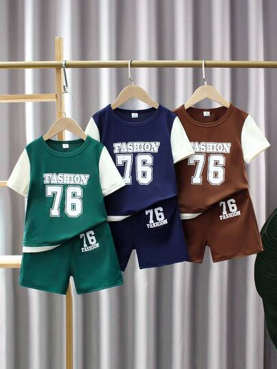 6pcs/Set Young Boy Casual Sports College Street Cute Cool 76 Letter Graphic T-Shirt + Shorts, Suitable For Daily Wear, School, Outings, Sports, Spring/Summer. Provides Multiple Matching Options For Toddler Boys, Increasing The Diversity Of Outfit Combinations. The Overall Design Is Simple And Generous, Comfortable And Fashionable To Wear. Toddler Boys Wearing This T-Shirt Set Will Feel Comfortable And Exhibit A Casual Chic Look. This Outfit Set Will Become A Practical And Fashionable Choice In The Wardrobe Of Toddler Boys.