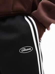 SUMWON Quần jogger ống rộng phối sọc bên hông, dáng thoải mái, thích hợp mặc ở nhà, có dây rút ở eo, phong cách thường ngày năng động, thoải mái để mặc hàng ngày. - màu đen - Xem 6
