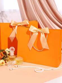 1/5pcs-Landscape-Style Kraft Paper Gift Bags, Shopping Bags, Packaging Bags With Handles, Bow-Decorated Handbags, Trick Or Treat, Halloween, White Large-Capacity Paper Bags, Halloween, Thanksgiving, Christmas, New Year, Wedding, Birthday Gift Packaging Bags - Orange - View 4