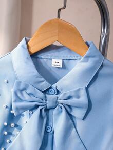 女童泡泡袖长袖衬衫，肩部饰有珍珠，配有可拆卸蝴蝶结，宽松版型，活力十足，面料舒适，适合搭配背带裙或作为内搭，春秋季穿着。 - 霧霾藍 - 查看 3
