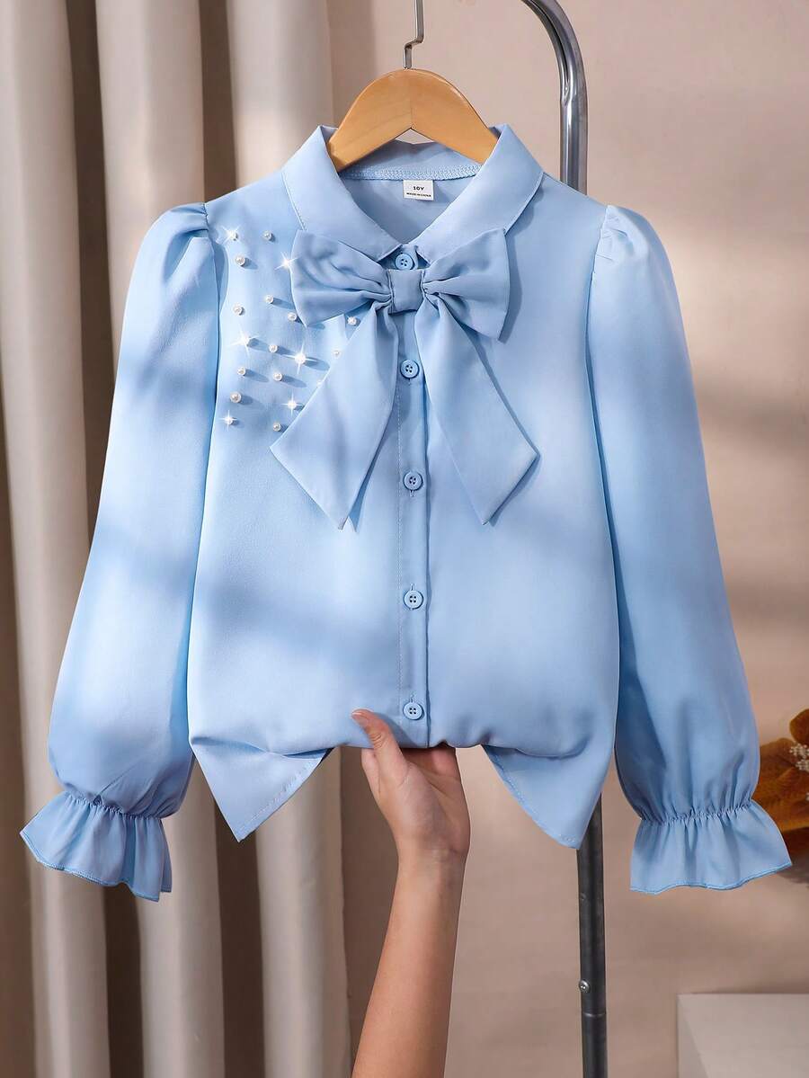 女童泡泡袖长袖衬衫,肩部饰有珍珠,配有可拆卸蝴蝶结,宽松版型,活力十足,面料舒适,适合搭配背带裙或作为内搭,春秋季穿着。 - 霧霾藍 - 查看 1