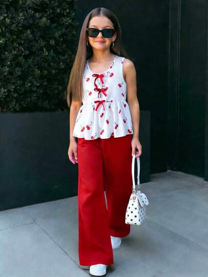 Set de 2 piezas para niñas jóvenes: Chaleco sin mangas con cuello redondo y estampado de cerezas con decoración de lazo rojo + Pantalones anchos y fluidos de pierna ancha rojos, conjunto casual dulce y juvenil para el verano