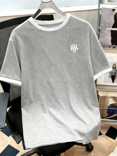 Manfinity Joysei Camiseta de hombre de talla estándar con patrón floral minimalista y puños de contraste