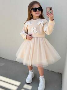 SHEIN Playful Pals Vestido de punto de manga larga con cuello redondo para bebés/niñas pequeñas, color albaricoque con decoración de lazo 3D en la parte superior, falda de tul en la parte inferior, suave en general, estilo lindo y dulce, casual y versátil para salidas de otoño/invierno - Albaricoque - Ver 7