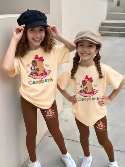 Girls' Apricot T-Shirt And Khaki Leggings Casual Fashion Creative Cartoon Cute Capybara, Kapibarasan, Heart, Bow, Cherry Blossom Tea Decorative Colorful Letter Slogan Graphic Print Short Sleeve T-Shirt And Pants 2 Pieces Set Capybara Clothing For Girl Capybara Clothes For Girls Girls Capybara Shirt And Leggings Set 2 Piece Girls Capybara Set Girls Capybara Outfit Fall Winter