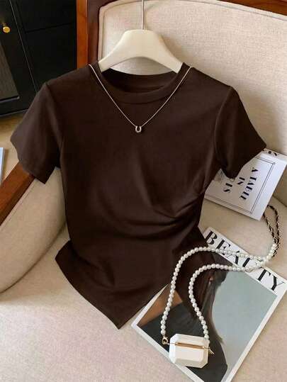 GlowEve Camiseta casual de mujer de unicolor, cuello redondo, manga corta con bajo asimétrico