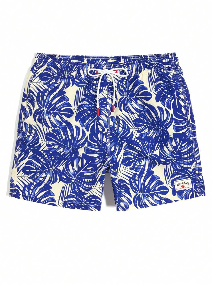 Manfinity Swimmode Shorts de playa con estampado de plantas tropicales, cintura con cordón y bolsillos para hombres - Azul - Añade 6