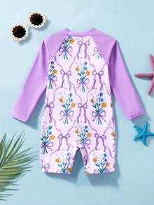 SHEIN Traje de baño de una pieza con estampado de moño púrpura de manga larga para niñas jóvenes, adecuado para vacaciones, natación, aguas termales, playa, surf, primavera/verano - Morado - Ver 2