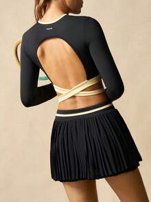 VARSIVA Women's Black And Yellow Crossover Hem, Cutout Back, Short-Sleeved Top And Contrasting High-Waisted Pleated Skirt With Built-In Jumpsuit Shorts Tennis Outfit.