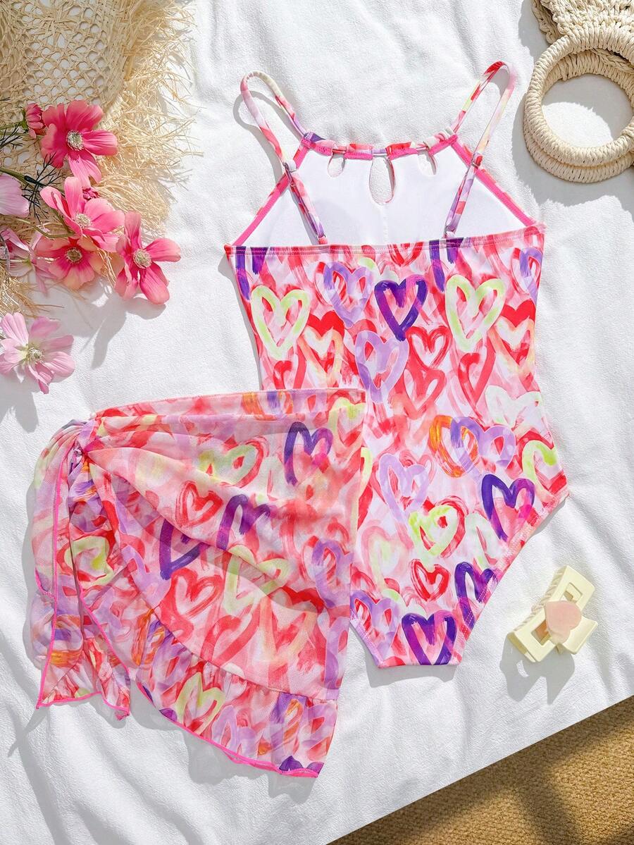 SHEIN Áo tắm liền thân kiểu yếm cho bé gái 8-12 tuổi kèm váy che ngoài, họa tiết trái tim màu nước, thiết kế khoét eo, chất liệu co giãn, thích hợp cho bơi lội ở bãi biển và hồ bơi. - Nhiều màu - Xem 1