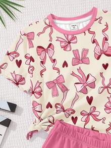 Bộ 2 món cho bé gái tuổi teen, gồm áo thun và quần short in hình trái tim và nơ dễ thương, phong cách tối giản thường ngày, phù hợp cho mùa hè. - Nhiều màu - Xem 5