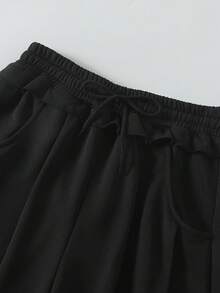 Sparklyn 一套女士及少女时尚宽松舒适灰色卫衣裤套装，采用毛边下摆设计，喇叭裤型，适合休闲、旅行、聚会、运动、上学、通勤等多种场合，春、秋、冬三季皆宜。 - 黑色 - 查看 7