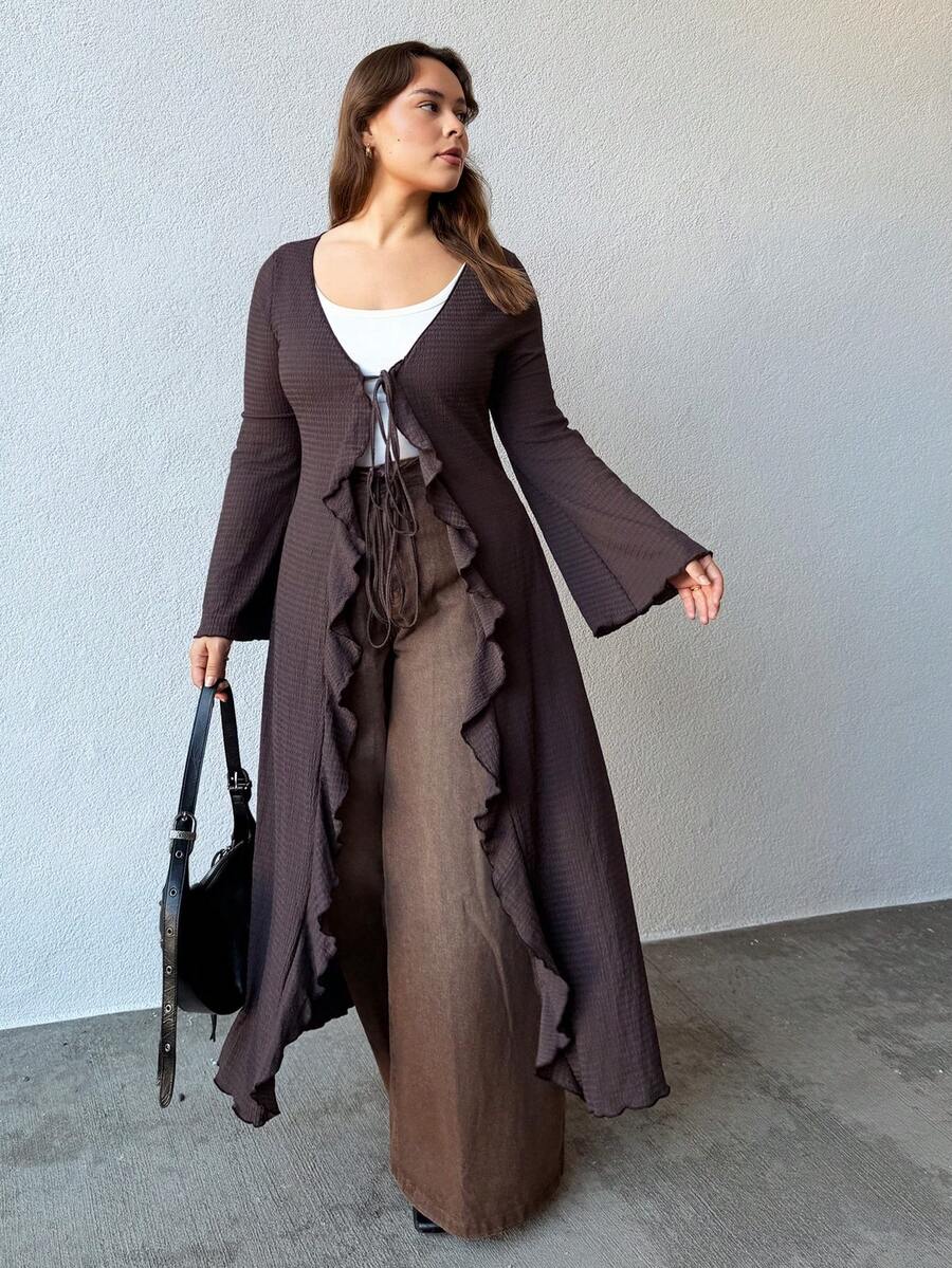 Nezia Cruz Blusa de punto con cuello en V, mangas de campana y detalle de lazo en la parte delantera, para mujer talla grande de la marca ICON - Marrón - Ver 1