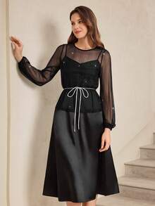 Miaspire This Elegant Women's Dress Features A Classic Pure Black Base. The Sheer Fabric Of The Bodice Is Adorned With Delicate Shimmering Silver Threads, Creating A Textured Contrast With The Matte Satin Skirt, Exuding A Subtly Luxurious Feel. The Floral Pattern Is A Minimalist Solid Color Design, Understated Yet Sophisticated. The Silhouette Consists Of A Sheer Long-Sleeved Top, A Belted Waist, And A Flowing Satin Skirt. The Lightweight Fabric Is Versatile Enough For Various Occasions, Showcasing Elegant Style. Perfect For Summer, It's Suitable For Evening Events, Casual Gatherings, Or Romantic Dates. The Pure Black Base Conveys A Sense Of Sophistication, While The Combination Of Sheer Fabric And Satin Showcases Fashionable Taste. It's A Versatile And Stylish Choice For Your Summer Wardrobe.,Summer Outfits - Black - View 1