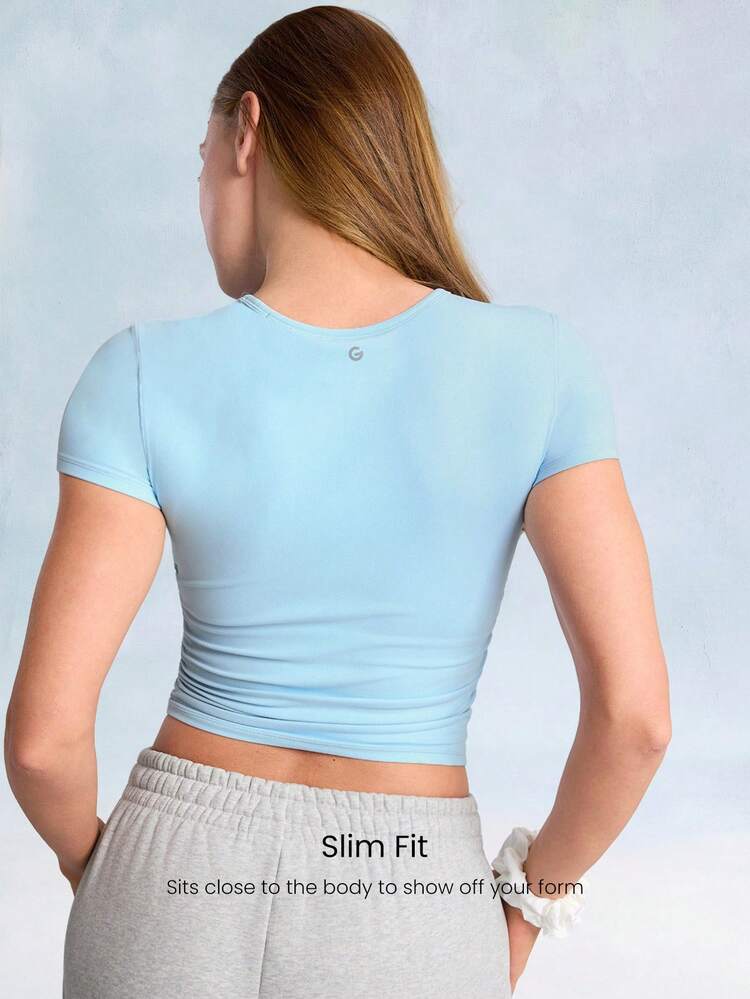 FeatherFit™ T-shirt à manches courtes plissé avec cordon de serrage, soutien léger, yoga et fitness à faible impact