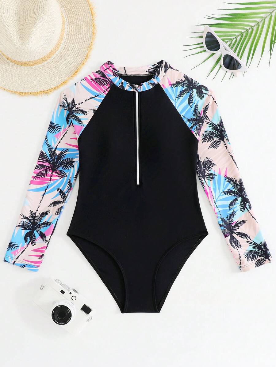 SHEIN 少女连体泳衣 这款可爱的三角连体泳衣专为少女设计，是海滩度假的完美之选。泳衣采用黑色椰子树印花，针织面料，长袖设计可有效防晒，并配有拉链。时尚休闲又不失优雅迷人的女性气质，是游泳、夏季假期、海滩之旅、泳池派对、夏季假日派对和休闲度假的理想之选。少女防晒衣套装 - 黑色 - 查看 1