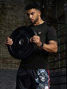 Manfinity Sport Corelite T-shirt de sport à manches courtes, respirant, avec graphique lettrage, décontracté pour homme, été