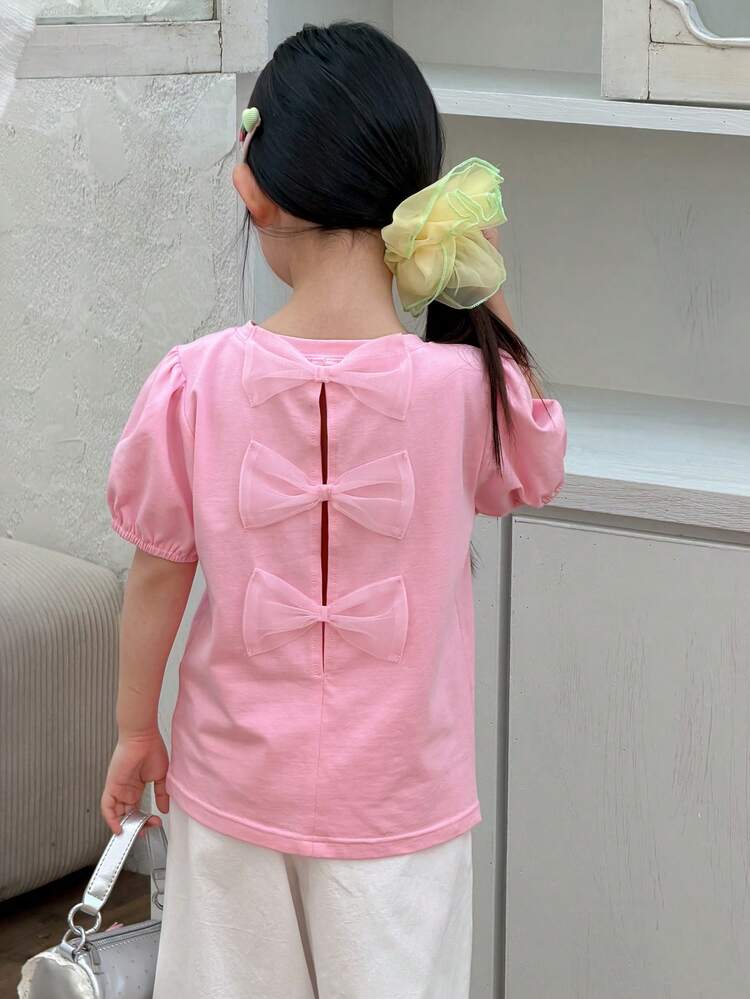 Young Girl Solid Color Round Neck Short Puff Sleeve T-Shirt With Bow Decor On Back Spring Summer