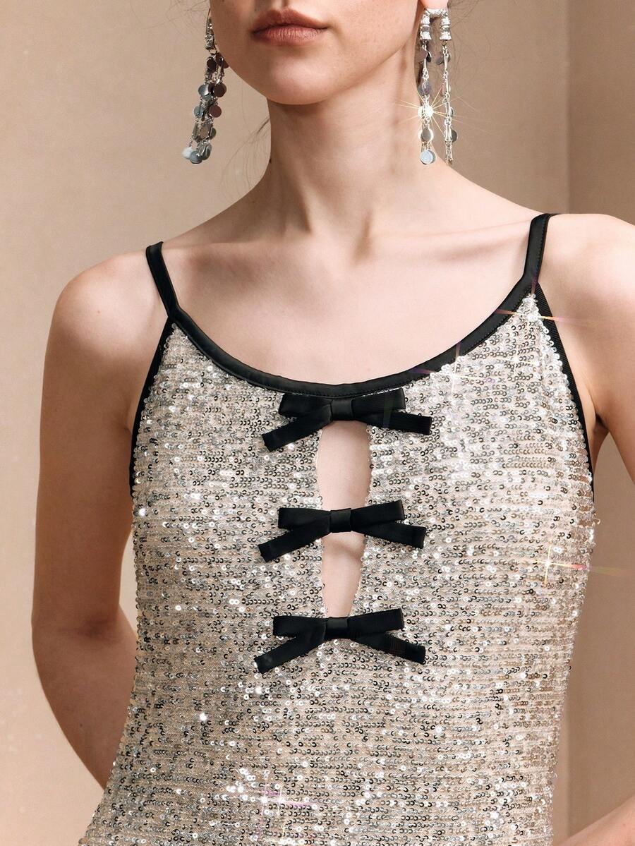 Revavyn Áo đầm nhung bạc lấp lánh đính sequin, hở lưng, dáng ôm, thiết kế nơ sequin khoét sâu ở ngực, thanh lịch cho buổi hẹn hò, áo cổ yếm sang trọng cho đám cưới, tiệc tùng mùa đông, áo kiểu dự tiệc cho nữ, kỳ nghỉ, ngày Valentine. - Bạc - Xem 1
