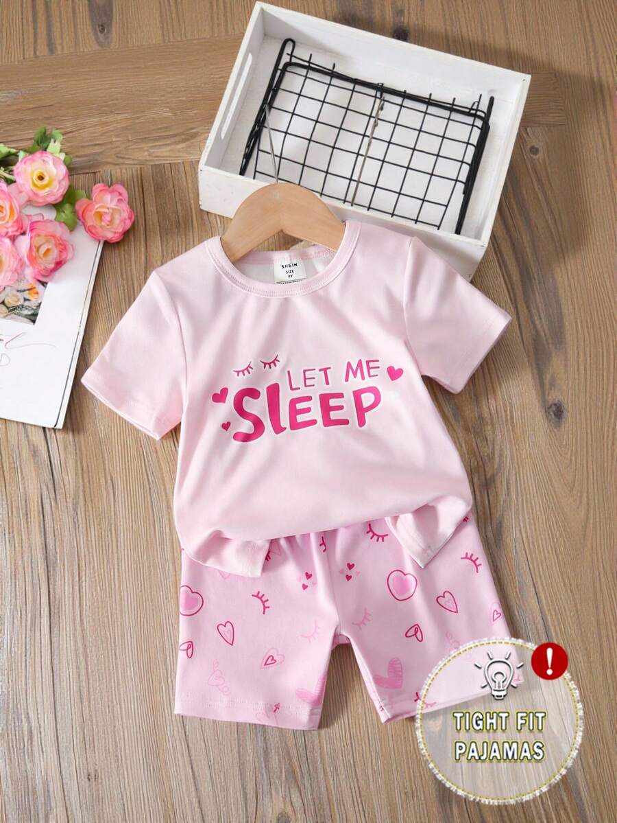 Bộ đồ ngủ ôm sát cho bé gái, áo tay ngắn và quần short, thiết kế họa tiết trái tim và lông mi đáng yêu, chất vải mềm mại và thoải mái, thích hợp cho bé mặc ở nhà. - Hồng - Xem 1