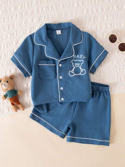2pcs Young Boy Lightweight Double-Layer Crepe Fabric Pocket Button Front Short Sleeve Top And Shorts Soft Comfortable Pajama Set, Blue Bear Print