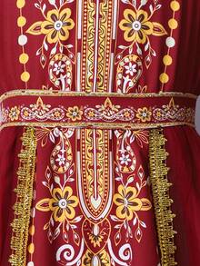 SHEIN Tween Girls' Burgundy Long Sleeve Robe. The Main Body Is Made Of Burgundy Fabric, With A Sheer Chiffon Hem That Provides A Flowing And Lightweight Feel. The Neckline, Front Placket, And Cuffs Feature Golden-Colored Printed Patterns, Decorated With Beaded Prints. A Matching Printed Belt Is Included At The Waist. The Design Combines Elements And Festive Dress Features. - Burgundy - View 5